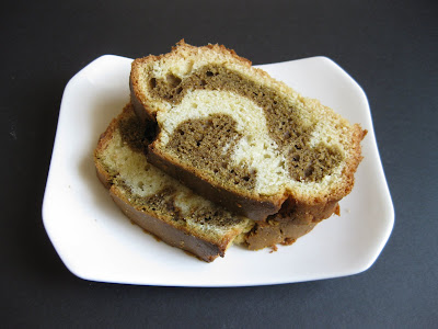 two slices of marbled cake on a white plate.