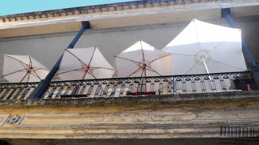 Sun umbrellas in a small café in the Pasaje de la Defensa in San Telmo in Buenos Aires, Argentina