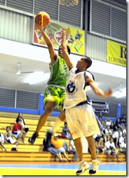 (left) M. Aying goes for a layup. photo by Adrian Marquez