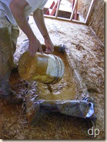 Putting clay slip into the trough