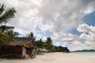Beach Huts on the Seafront of Malcapuya Island