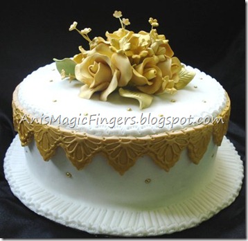 white and gold wedding cake for hantaran ordered from Lynn tauke Insurance