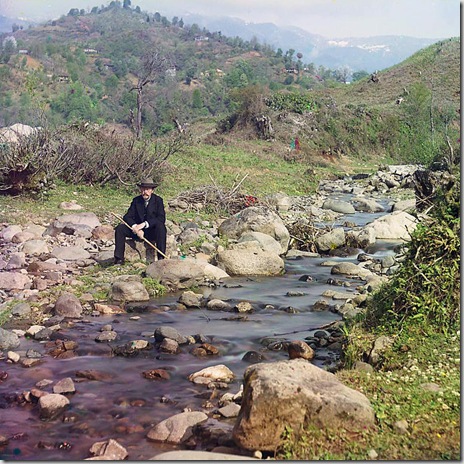 On the Karolitskhali River, self portrait of photographer Prokudin-Gorskii in suit and hat, seated on rock beside the Karolitskhali River, with mountains in background; between 1905 and 1915
Sergei Mikhailovich Prokudin-Gorskii Collection (Library of Congress).