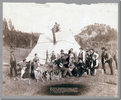 Title: Happy Hours in Camp. G. and B.&M. Engineers Corps and Visitors
Small group of men and women and two deer in front of a tent. Some of the men are playing musical instruments. 1889.
Repository: Library of Congress Prints and Photographs Division Washington, D.C. 20540