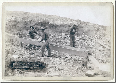 Title: "Gold Dust." Placer mining at Rockerville, Dak. Old timers, Spriggs, Lamb and Dillon at work
Three men placer mining with shovels, picks and pan. 1889.
Repository: Library of Congress Prints and Photographs Division Washington, D.C. 20540