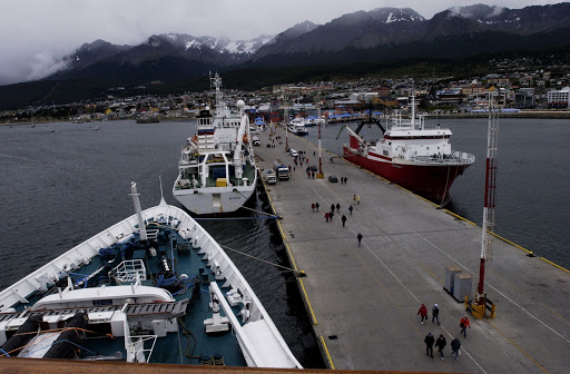 005d2Ushuaia - This is the pier in Ushuaia, at the tip of Argentina, from where both research and cruise vessels depart. In the background are the snow-capped mountains of Patagonia.