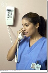 portrait_of_a_young_female_nurse_talking_on_the_127580h