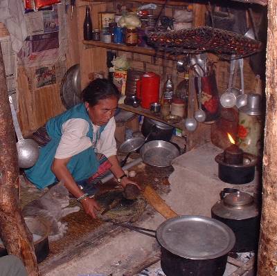 Cooking over an open stove in a Rolwaling teahouse
