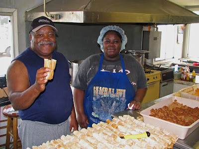John Williams, Jr. and his daughter making tamales, Cleveland, MS