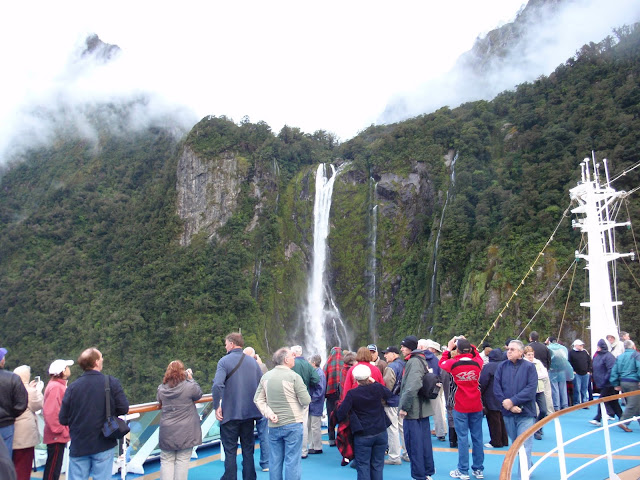 Passengers gather on deck for views of the waterfalls From 12 Tips to Optimize your Cruise Experience