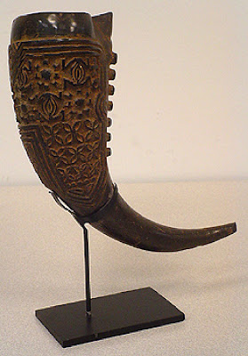 Royal Ceremonial Drinking Horn—small in size – carved buffalo horn with dark brown patina, incised spider motif, un-carved plain tip. 20th century.  6.50" h x 2.375" w x 2.625"d, mounted.
