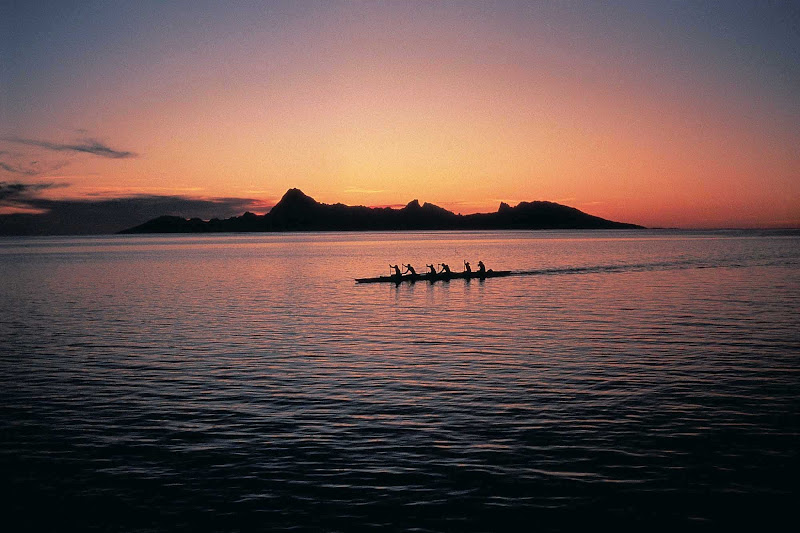 The sight of an outrigger canoe at sunset transports you back in time.