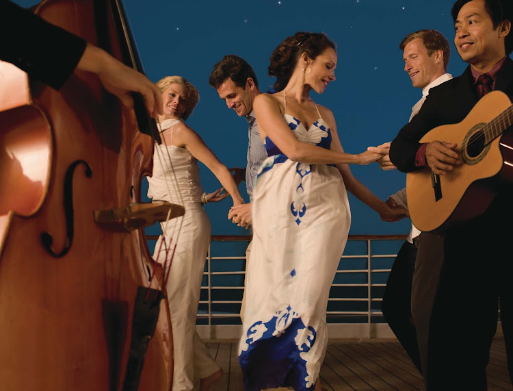 Sway to the music and feel the sea breeze while dancing on the deck of Seabourn Quest.