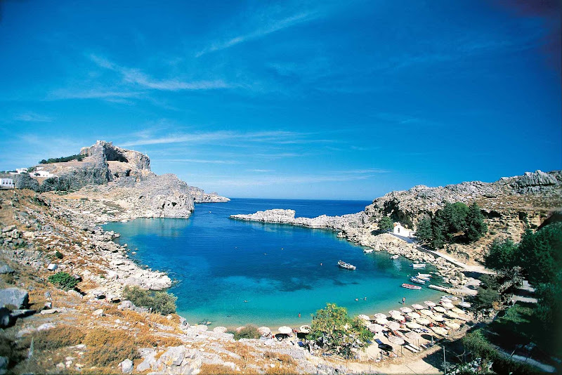 Explore the beautiful beaches and rugged coastline of the Greek island of Rhodes.