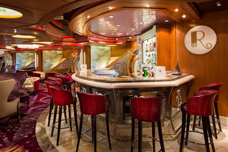 Relax and enjoy a pre-dinner drink at the R Bar aboard Navigator of the Seas.