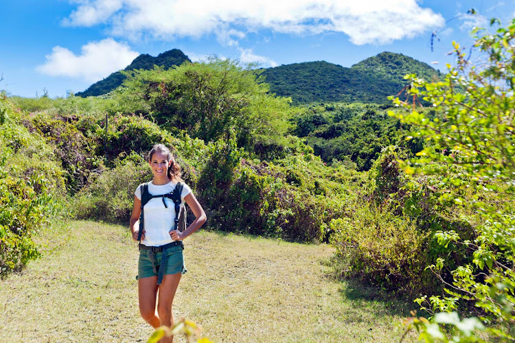 Hiking between the two smaller twin mountains of Signal Hill and Little Mountain on the island of St. Eustatius. 