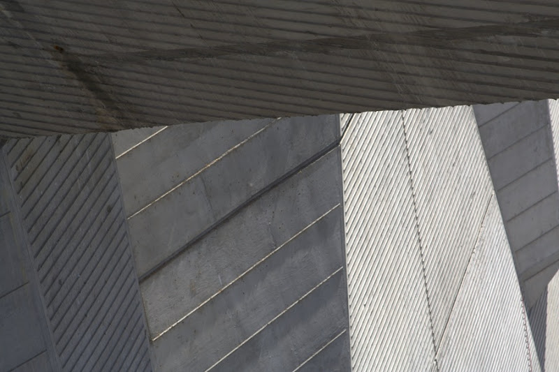 One single shot capturing the myriad angles and spacing of the textured concrete walls.