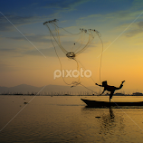 Fisherman and his net by Indrawan Ekomurtomo -  