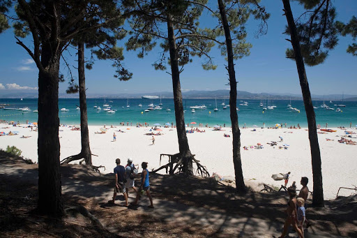 Rodas-Beach-Vigo- Spain - One of the best beaches in the world? That's what several noted publications have called Rodas Beach in Vigo, Spain. The beach is known for its crystal waters, white sandy beaches and natural dunes.