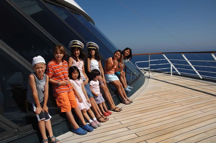 All hands on deck! Junior Cruisers pause while exploring Crystal Serenity.