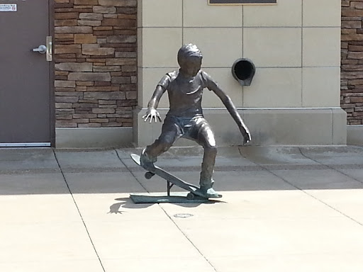 Statue of Boy on Skateboard