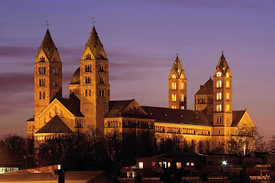 The Imperial Cathedral of St. Mary — officially the Imperial Cathedral Basilica of the Assumption and St. Stephen — at dusk in Speyer, Germany. Construction began in 1030 and was mostly completed in the 12th century. It's a UNESCO World Heritage Site. 