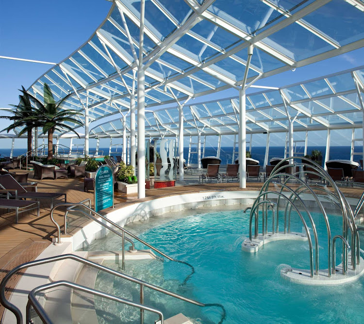 The Solarium on Allure of the Seas offers guests a place to soak up some rays and relax with a drink. 