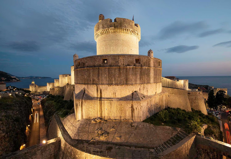 The historic fortified city walls and tower in Dubrovnik, Croatia. 