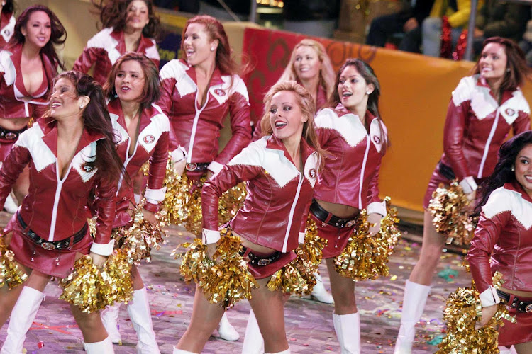 Cheerleaders from the San Francisco 49ers — the Gold Rush — participate in the Chinese New Year Parade in Hong Kong.