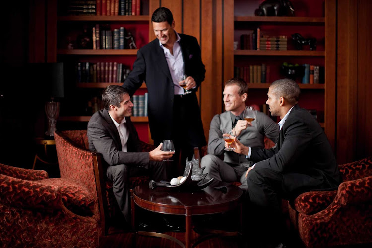 Kick back, swap stories and enjoy a drink in Michael's Club during your sailing on Celebrity Solstice.