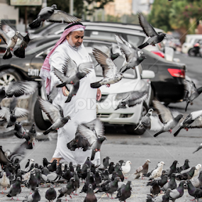 Here, Have Some. by Mohammad Alqorashi - People Street & Candids
