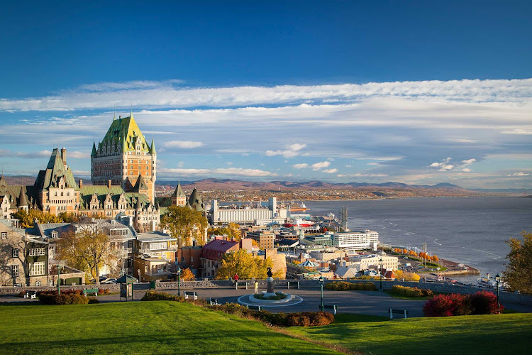 The Fairmont Le Chateau Frontenac towers over neighboring buildings in Quebec City.  It was designated a National Historic Site of Canada in 1980.