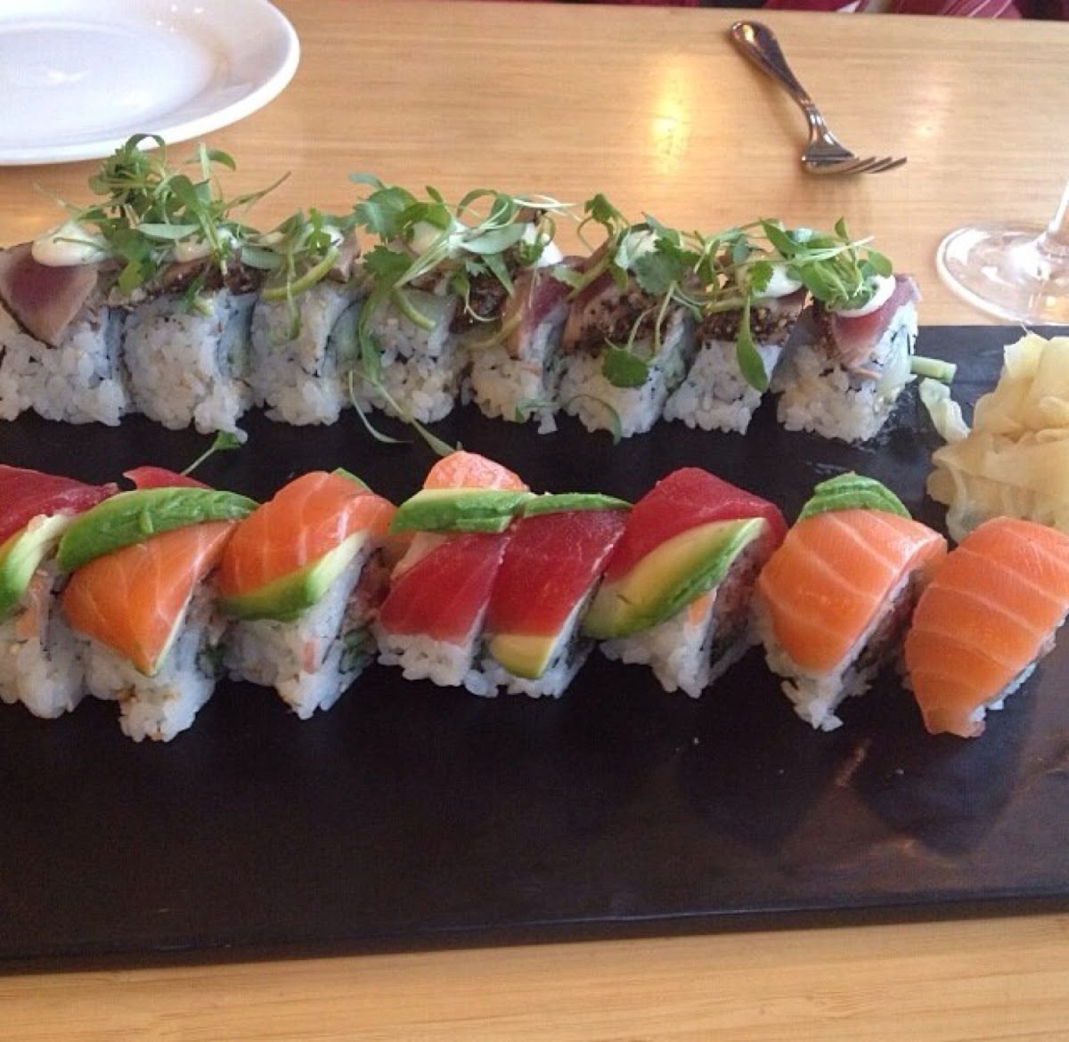 California roll with rainbow sashimi and the scallop ceviche roll topped with seared peppered tuna a