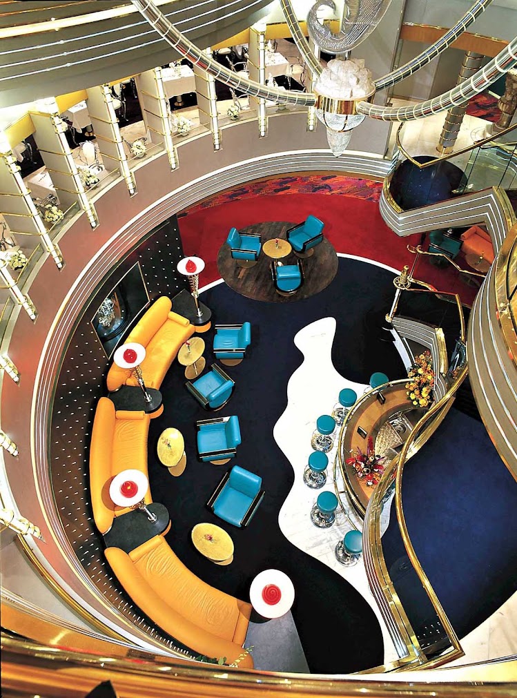 This is a view looking down to a spiral open space from the atrium staircase aboard Holland America Line's Zuiderdam.