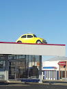 VW Bug on the Roof Art Statue