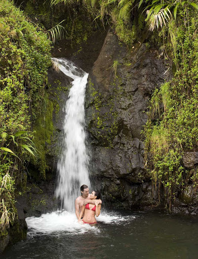 Couple-Under-Waterfall - Create a romantic memory under one of Tahiti's many waterfalls.