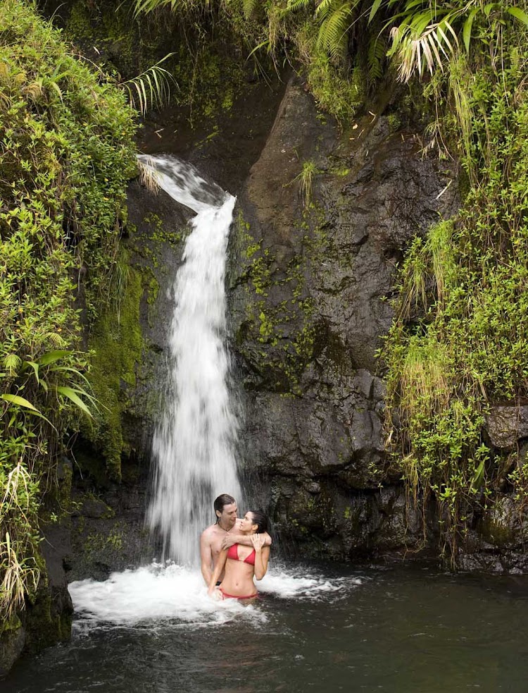 Create a romantic memory under one of Tahiti's many waterfalls.