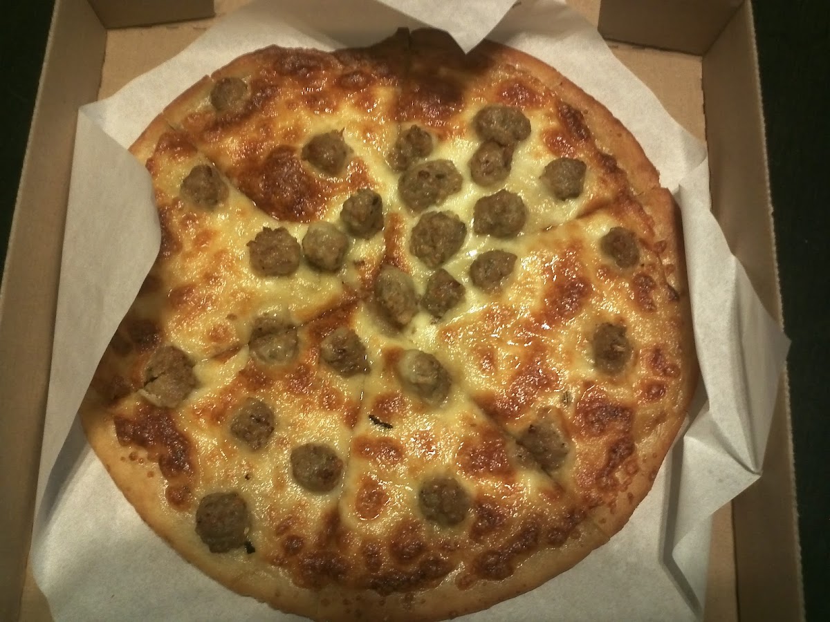 Pizza with italian sausage and garlic sauce