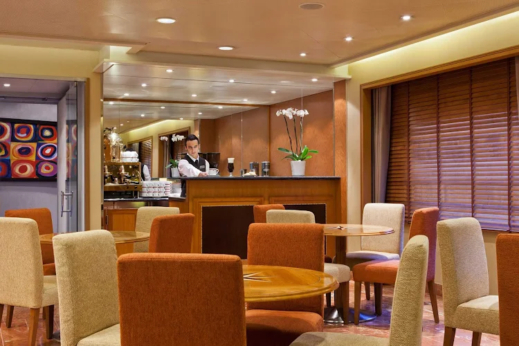 Sip a coffee drink and relax in the casual atmosphere of Coffee Connection on your Seven Seas Voyager cruise.