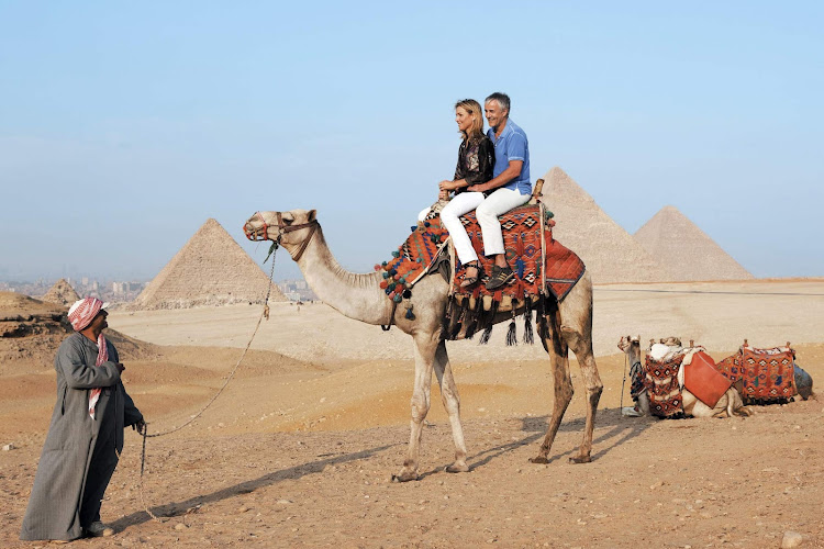 Explore the pyramids of Giza the old-fashioned way on a daylong shore excursion during your vacation in Egypt aboard Uniworld's River Tosca.
