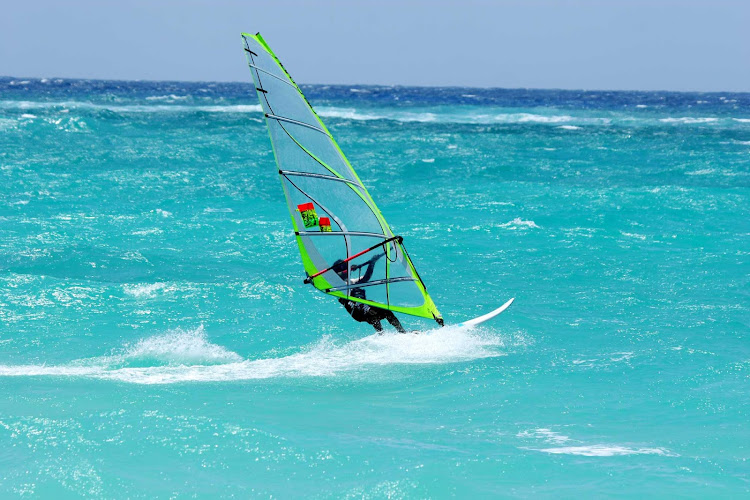 Windsurfing in the waters of Barbados.