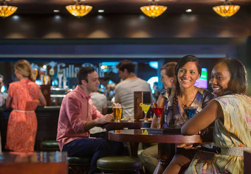 Modeled after pubs in Ireland, O'Gills Pub is a sports bar and lounge featuring Irish brews with a dark wood and brass décor. It's on deck 3 toward the front of Disney Magic. 