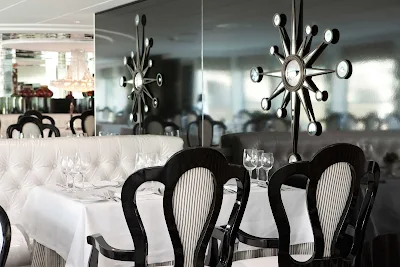 Watch the passing landscapes of Europe while dining on Uniworld's River Princess cruise ship. 