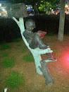 Boy Reading in a Tree Statue