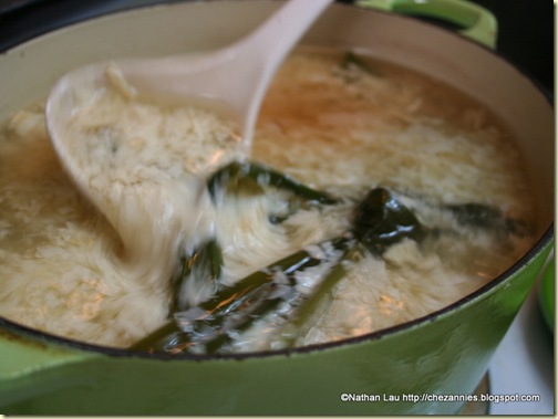 Stirring the barley soup with pandan and fuchok