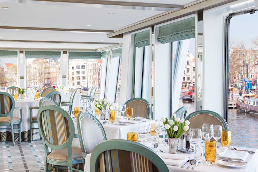 Uniworld-River-Duchess-restaurant - Dine in the elegant restaurant aboard Uniworld's River Duchess while taking in captivating views of passing landscapes during your European river cruise.