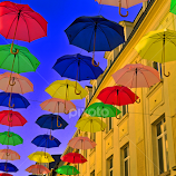 Umbrellas In The City 6 by Marco Bertamé -  