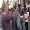 Punched by street performer logo