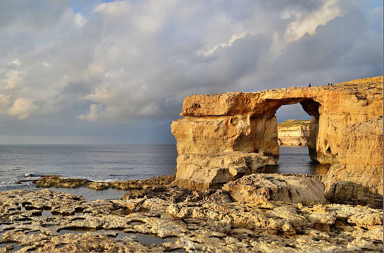 On the island of Gozo in Malta, the Azure Window is a natural arch located near the village of Dwejra. 