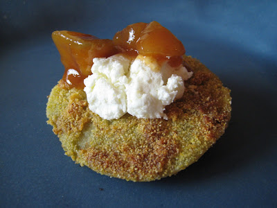 Fried green tomato topped with goat cheese and chutney